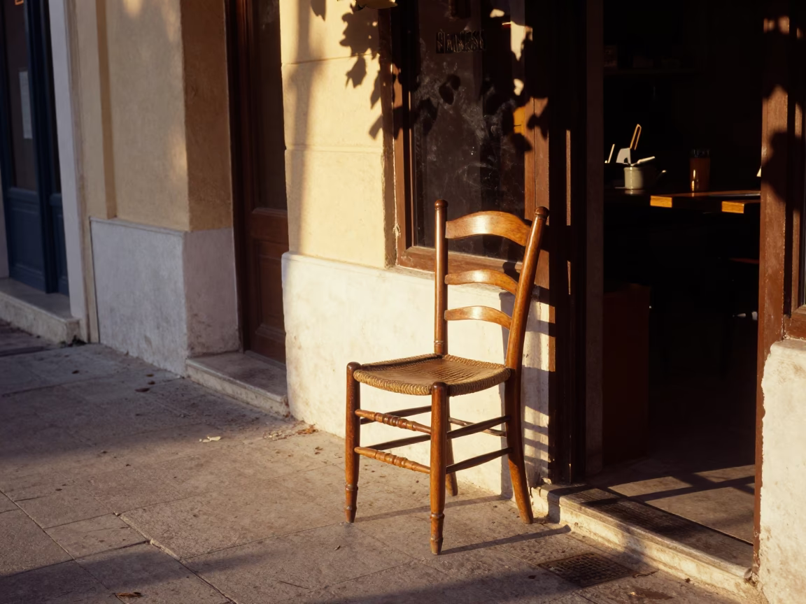 Athens Greece Golden Hour Street Scene with Spindle Chair and Leaf Shadows in in Athens, Greece