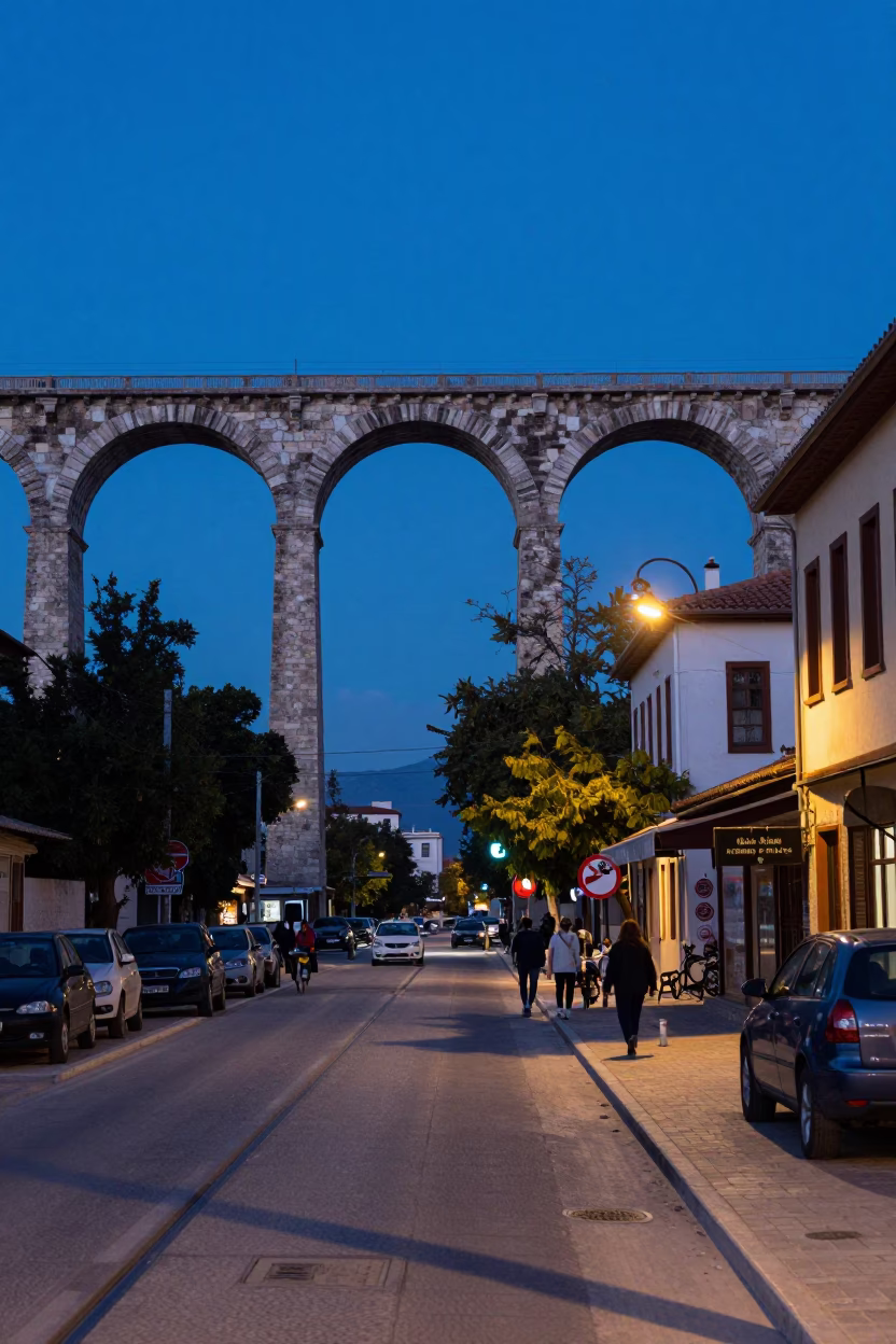 Athens Greece indigo twilight street scene with railway viaduct and urban life in in Athens, Greece