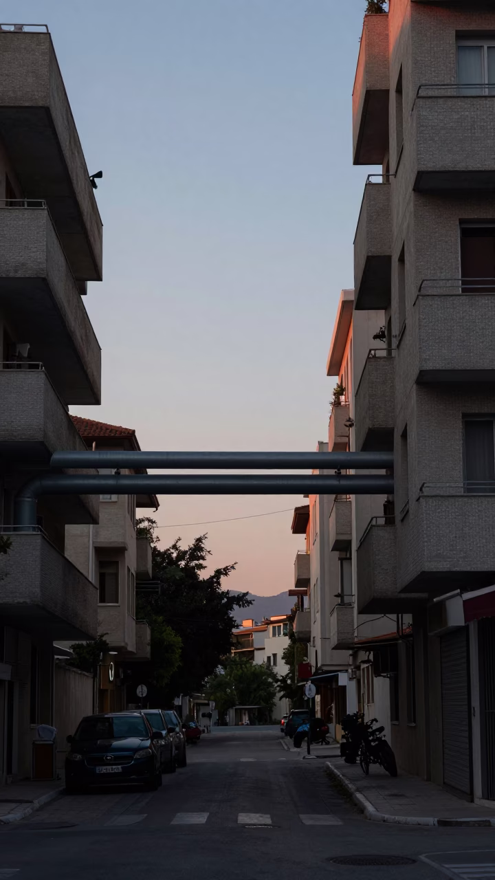 Athens Greece Pre-Dawn Street Scene with District Heating Pipes and Concrete Apartment Blocks in in Athens, Greece