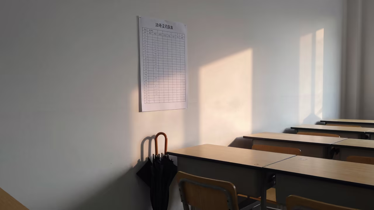 Attendance Sheet and Umbrellas in Jinan School Office in inside a quiet classroom in Jinan