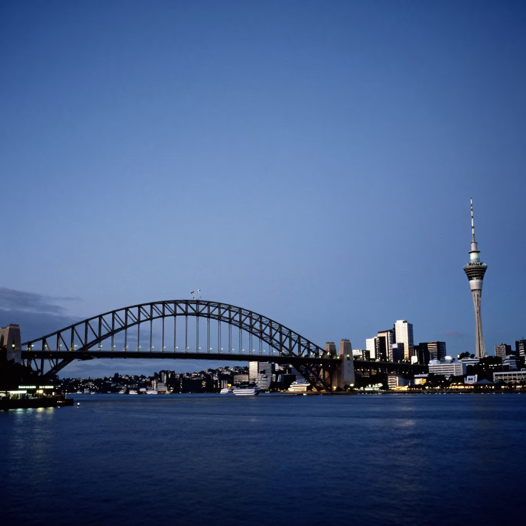 Auckland Harbour Bridge and Sky Tower Evening Lights with Ferry and City Skyline in in Auckland, New Zealand