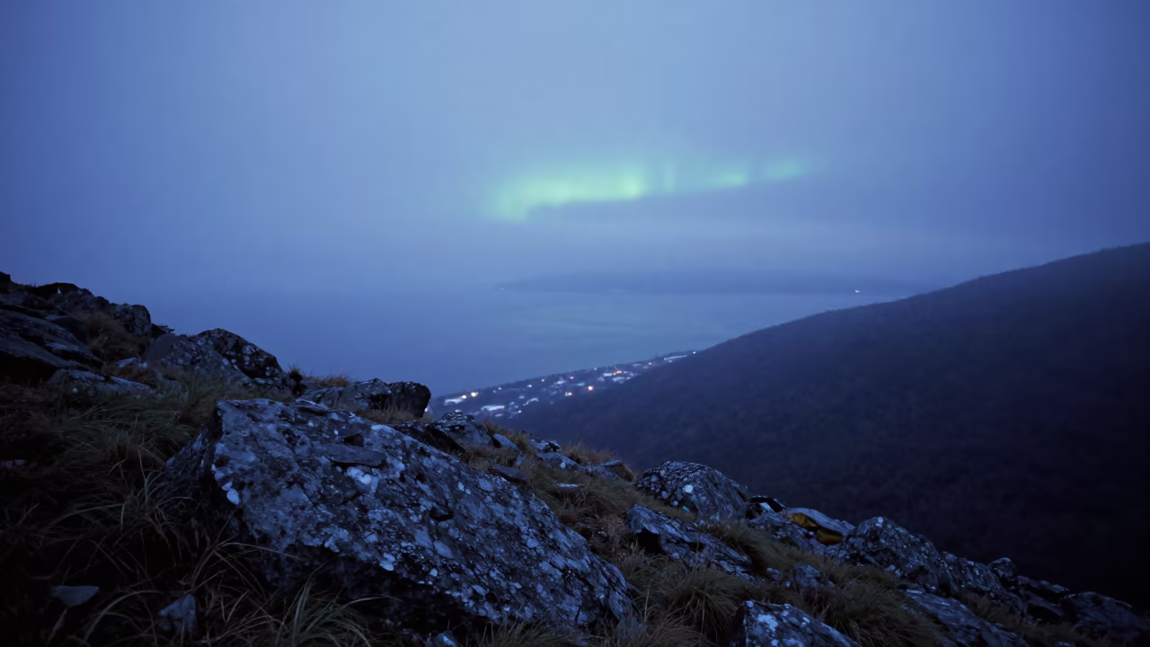Aurora australis curtain over Sapporo alpine coast in from a quiet alpine saddle near Sapporo