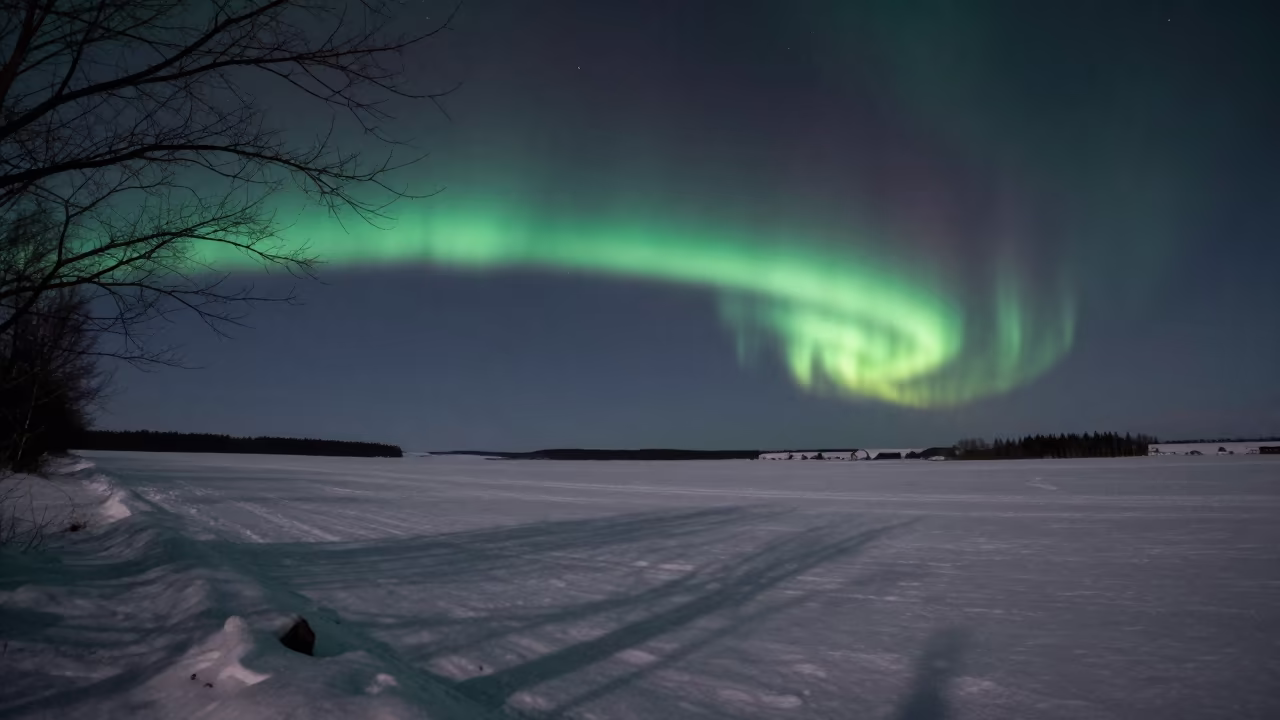 Aurora Borealis Over Danish Snowfield Night in from a quiet alpine saddle in Denmark