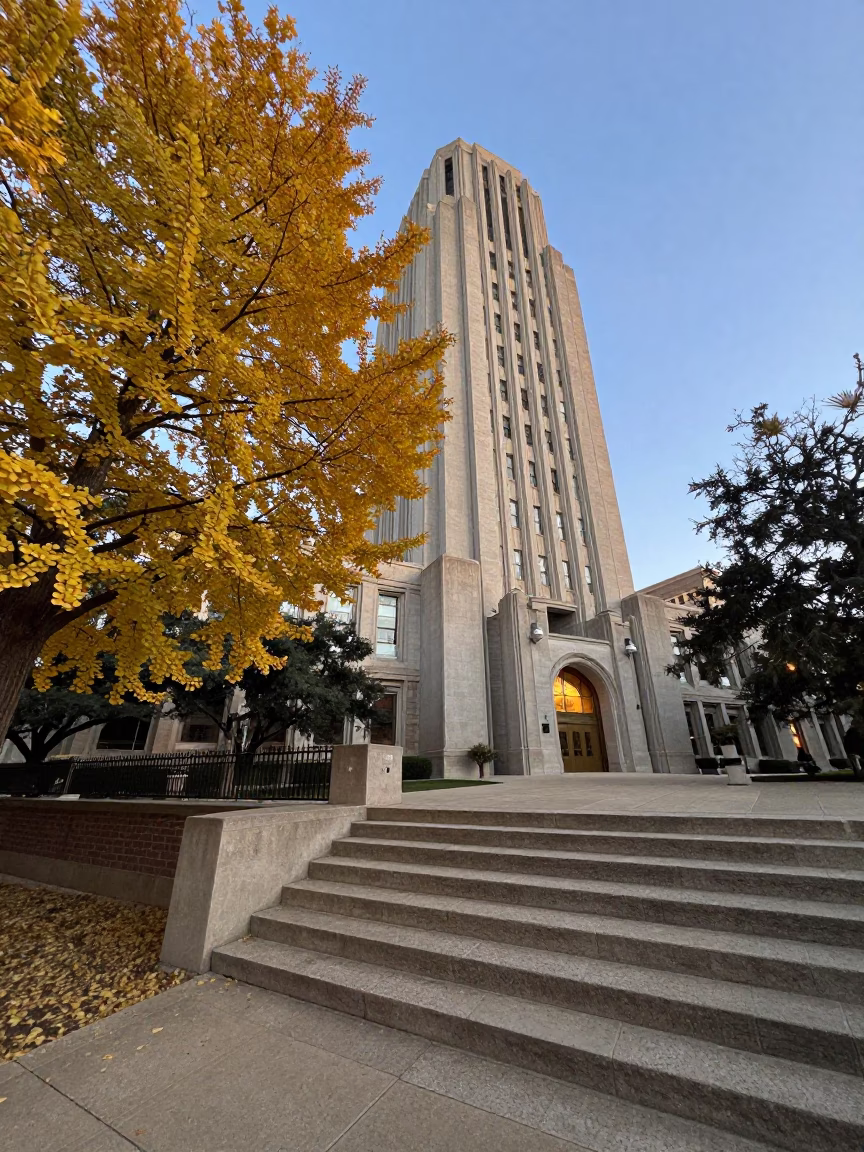 Austin Texas Brutalist University Tower at Dusk with Ginkgo Tree Leaves in in Austin, Texas, United States