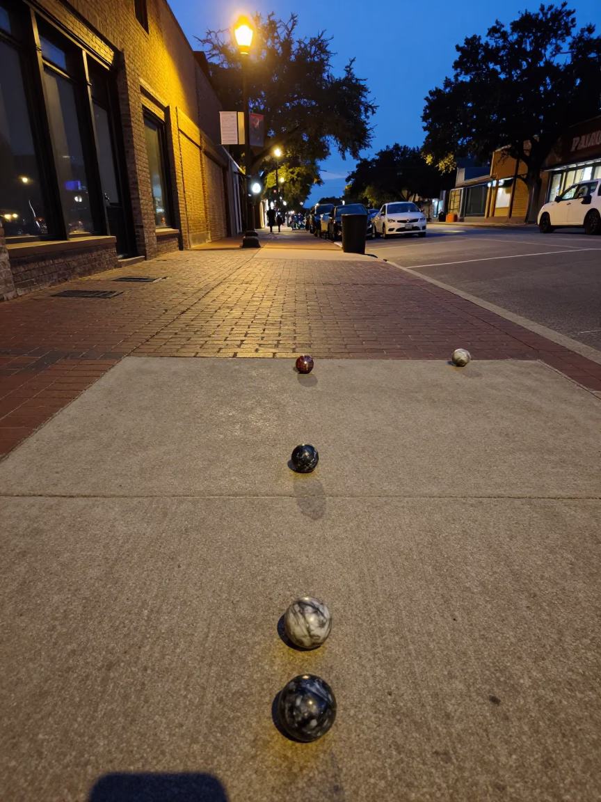Austin Texas Twilight Street Scene with Marble Game and Jam Jar on Sidewalk in in Austin, Texas, United States