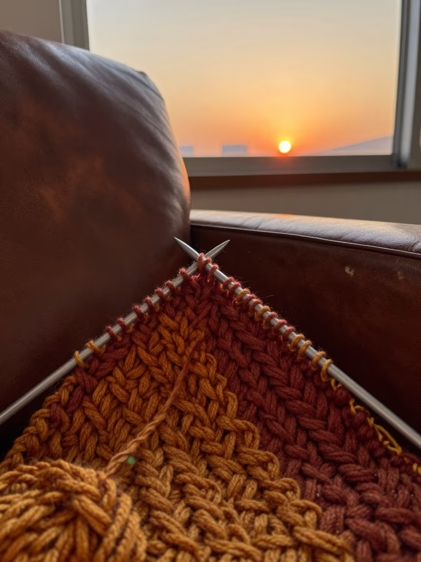 Autumn Knitting on Leather Chair Ulsan in on a worn leather armchair in Ulsan