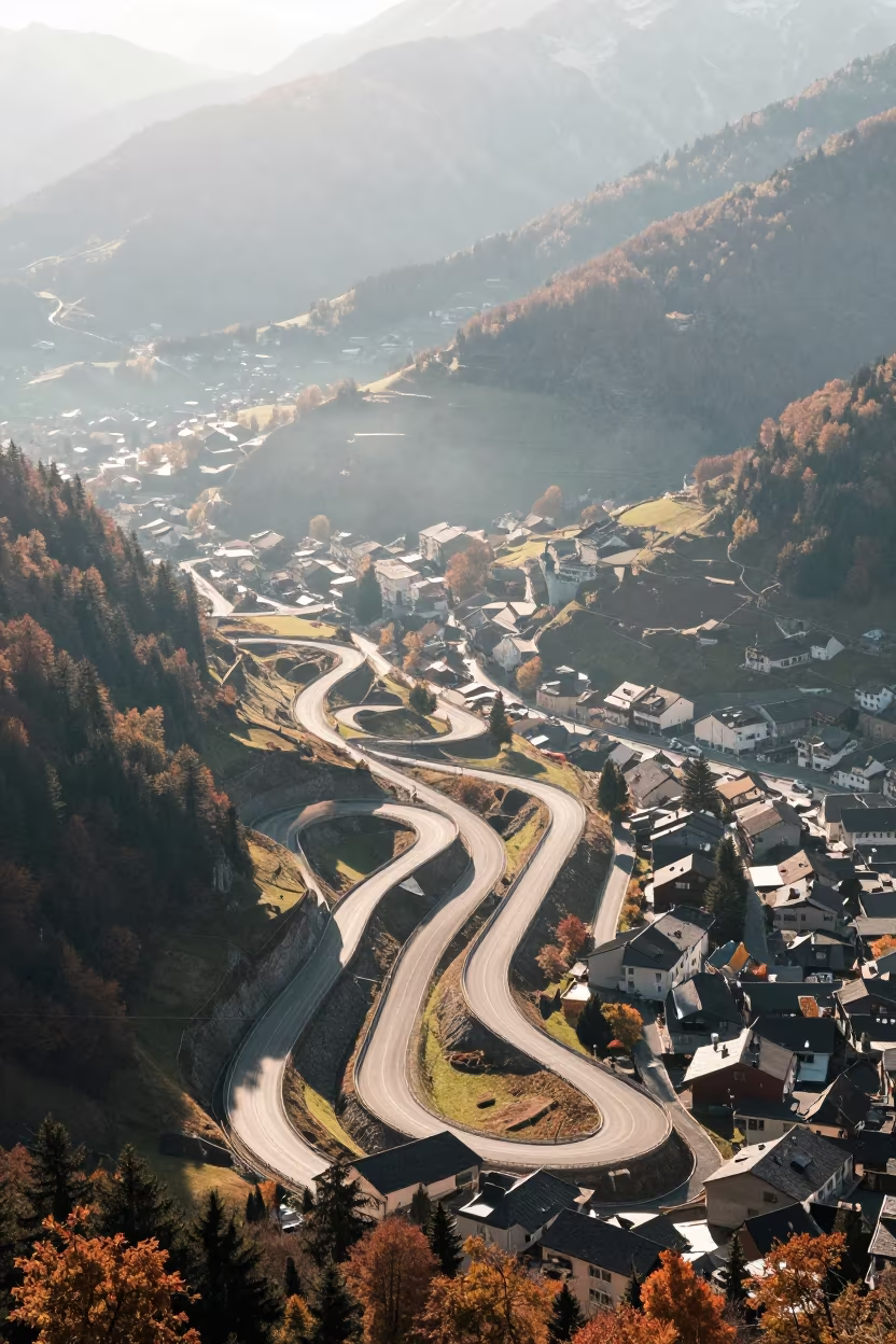Autumn Mountain Switchback Road Aerial View Innsbruck in high above patterned rooftops near Innsbruck