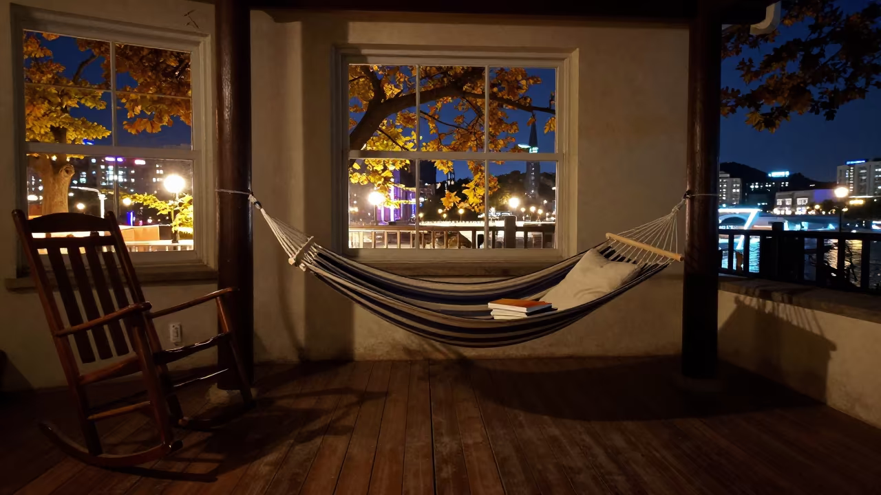 Autumn Porch Hammock with Book and Pillow in on a porch with a rocking chair in Qingdao