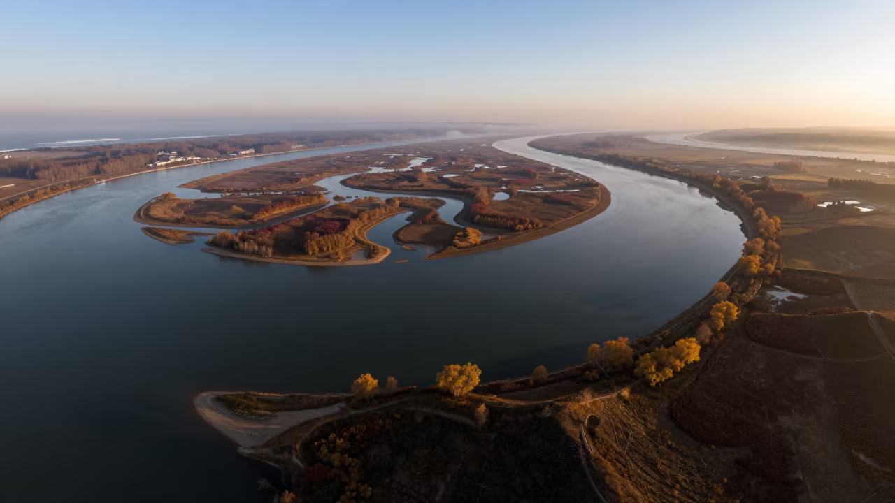Autumn River Delta Aerial View North Korea in far above surf-scalloped coastline in North Korea