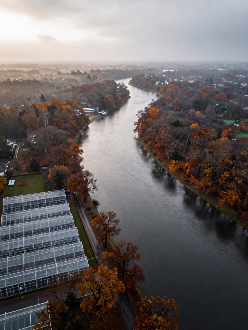 Autumn River and Winter Greenhouse Aerial View in high over greenhouse grids near Utrecht