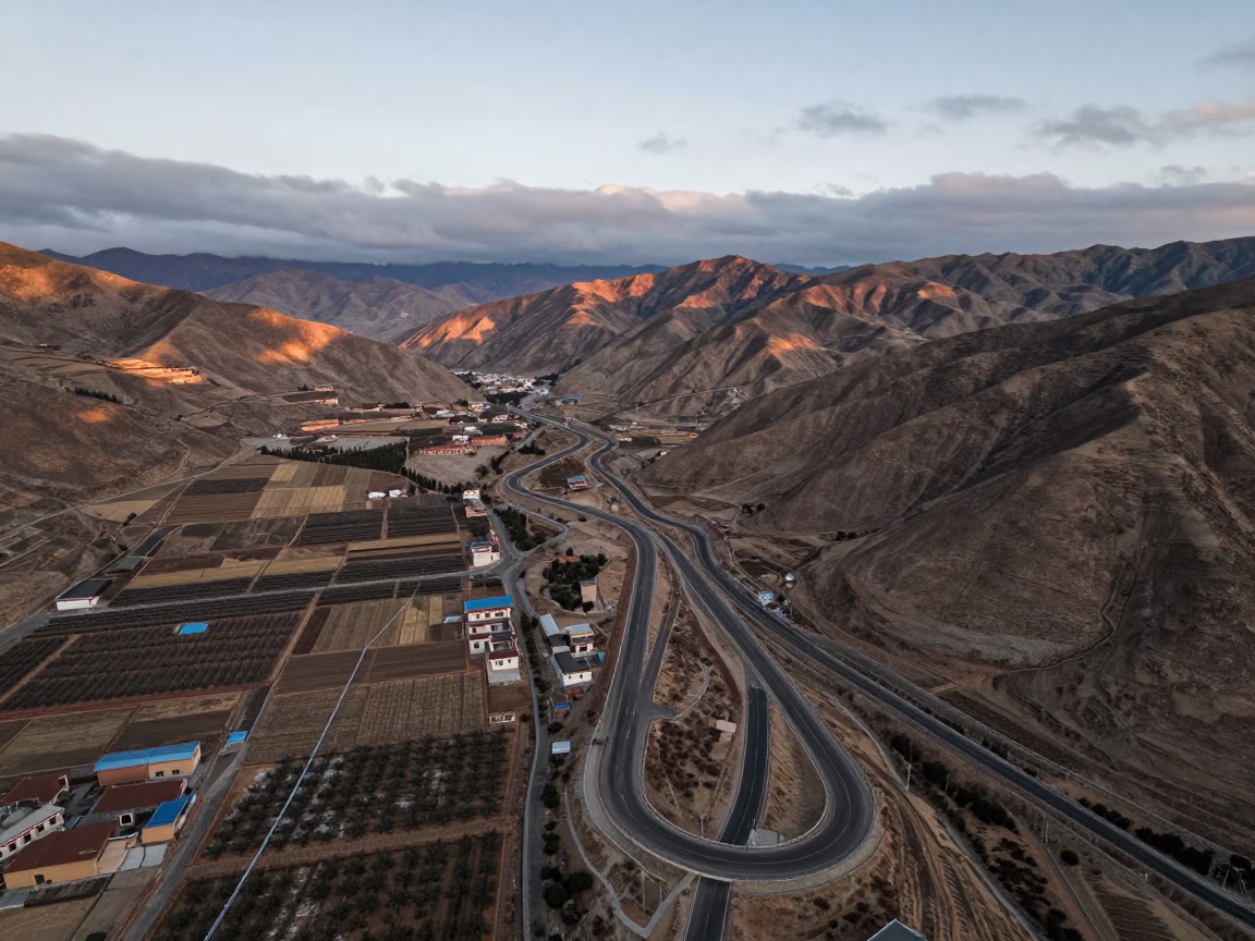 Autumn Switchback Road Above Lhasa Orchards in far above orchard blocks and irrigation lines near Lhasa