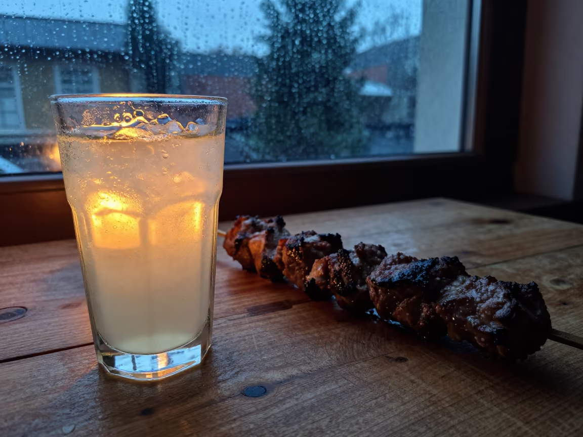 Ayran and Kebab on Rustic Table at Sunset in on a rustic wooden table in Ushuaia