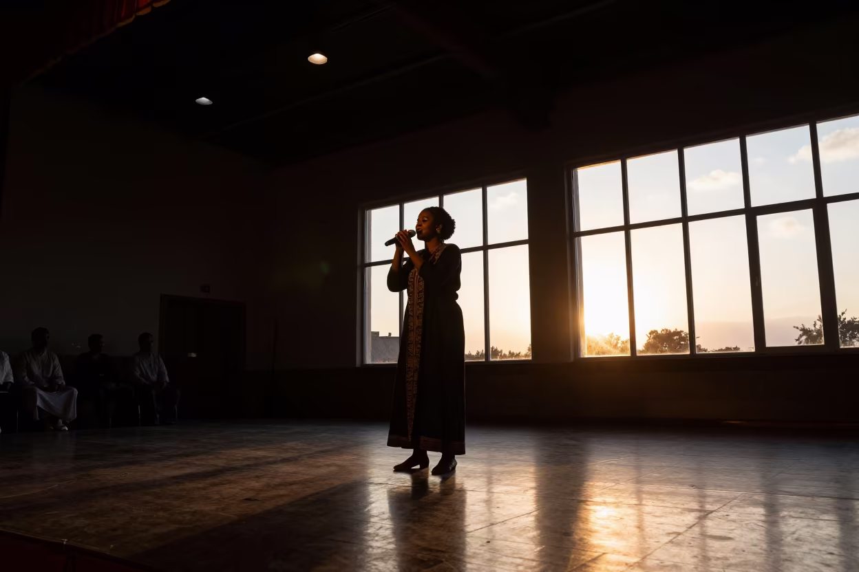 Azmari Singer Silhouette Sunset Concert Hall in in a concert hall in Vehari