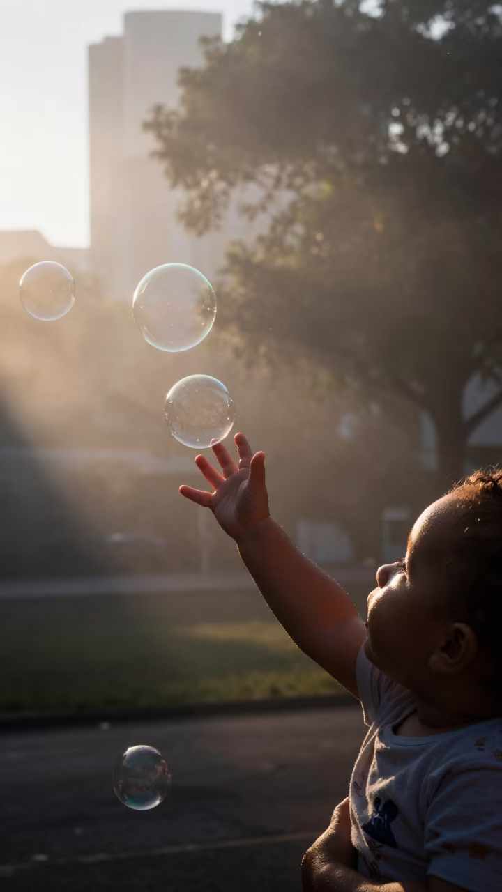 Baby Reaching Bubbles in Belo Horizonte Morning Fog in in Belo Horizonte