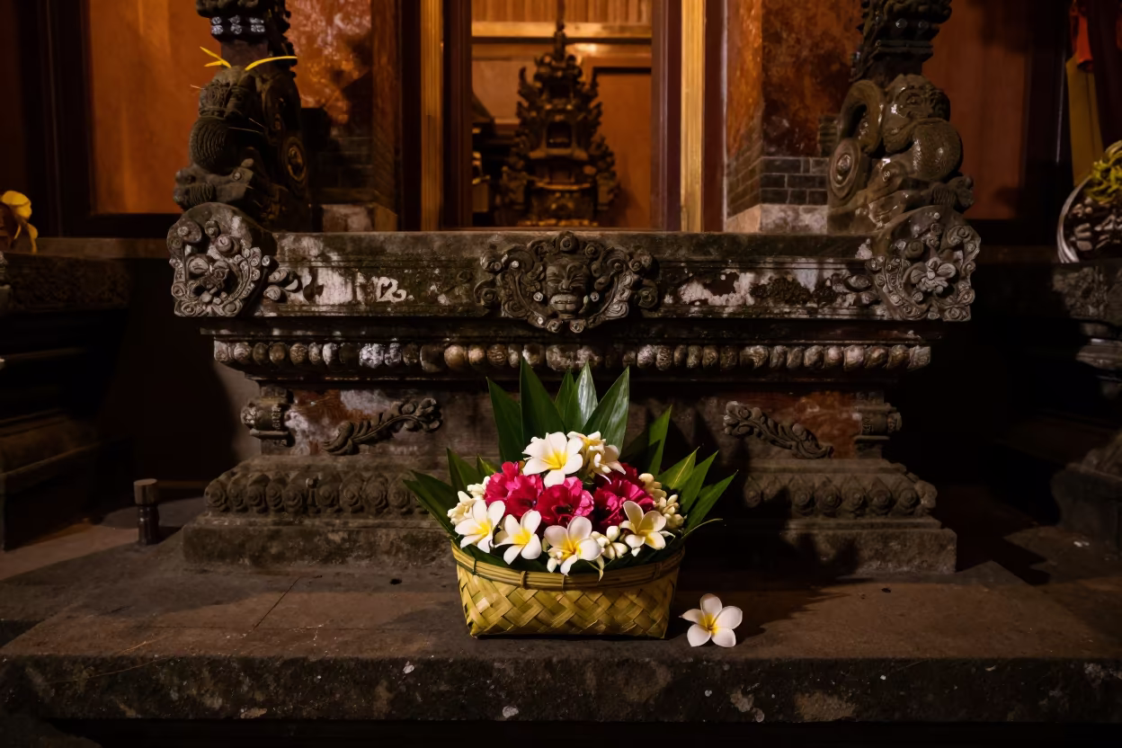 Balinese Flower Offering on Stone Altar in Jakarta in at the foot of a stone altar in Jakarta