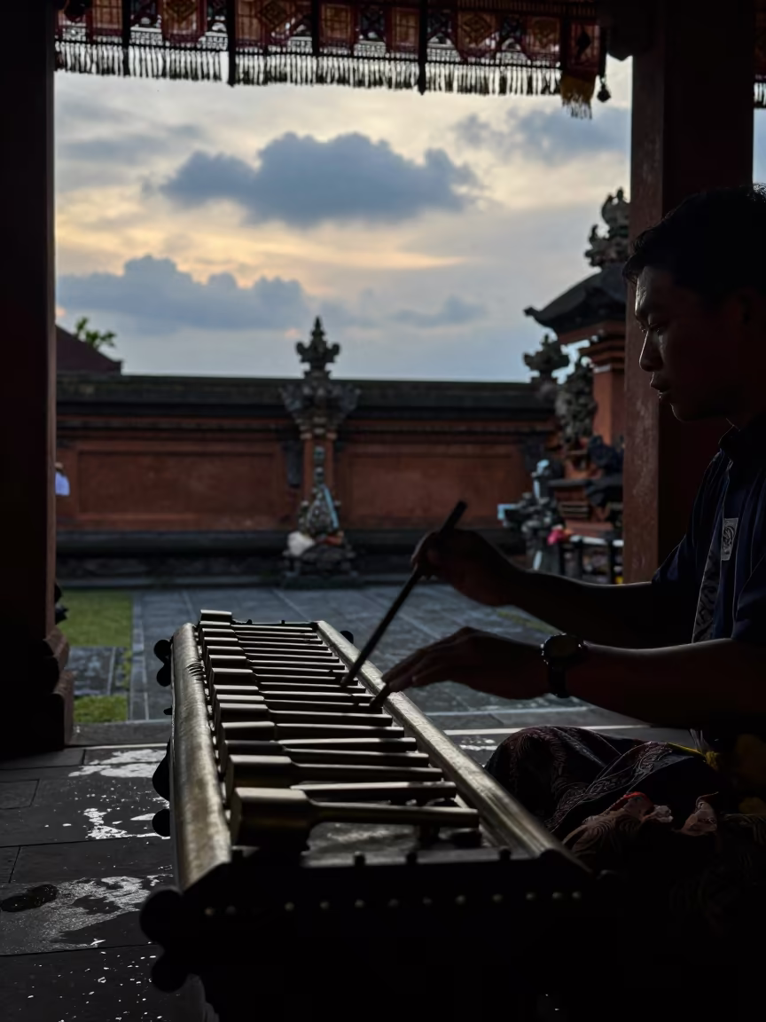 Balinese Gamelan Player Silhouette in Jakarta Courtyard in in a shrine courtyard in Kota Tua, Jakarta