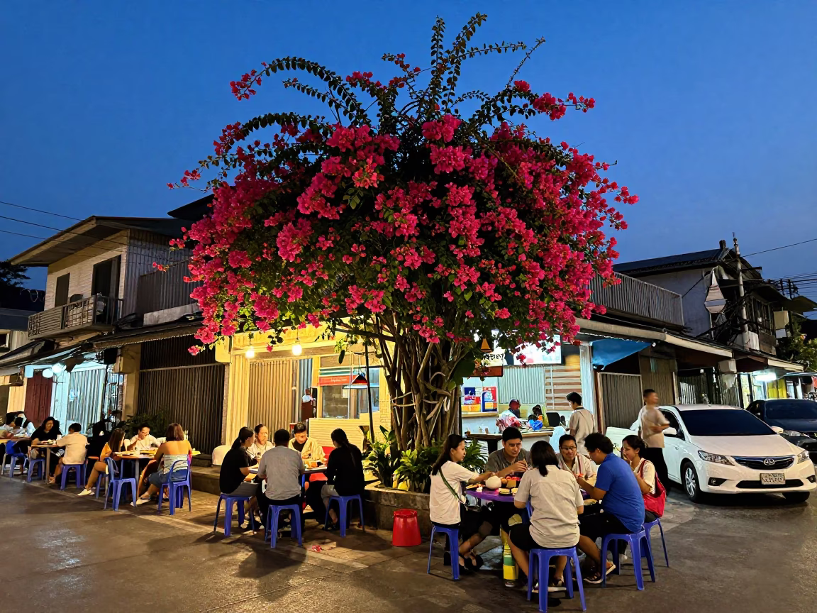 Bangkok Indigo Twilight Street Scene with Bougainvillea and Local Dining in in Bangkok, Thailand