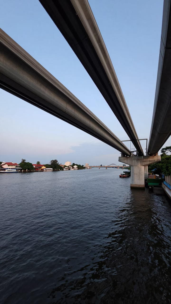 Bangkok Monorail Bridge Over Chao Phraya River at Early Morning Blue Hour in in Bangkok, Thailand