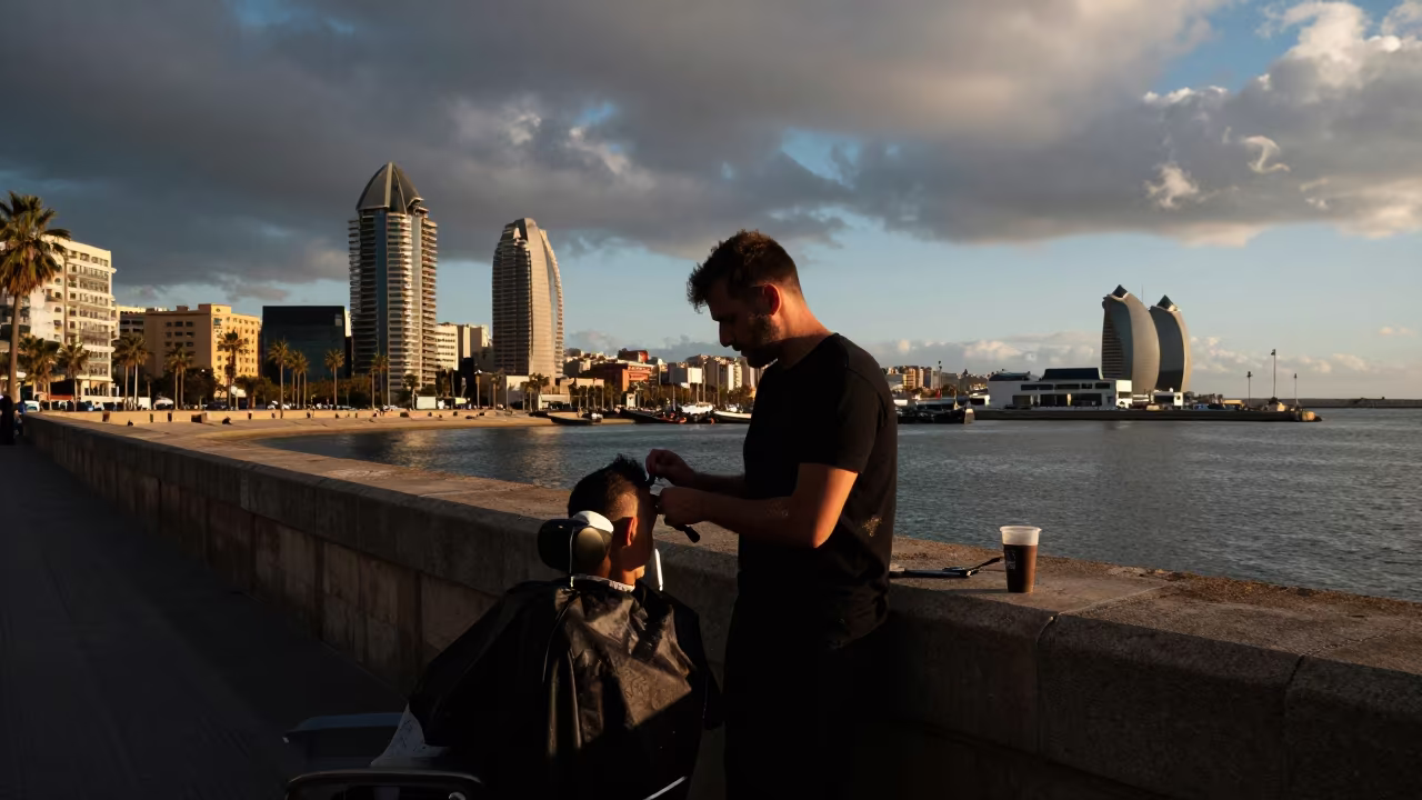 Barber at Harbor Wall Before Dawn Barcelona in at a roadside stop near Eixample, Barcelona