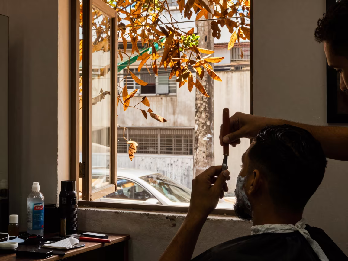 Barber Shaves Customer in São Paulo Golden Hour in in São Paulo