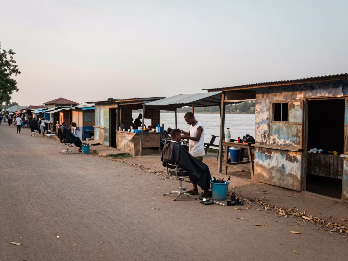 Barber Trimming Detail at Nacala Dawn Market in near a riverside landing in Nacala