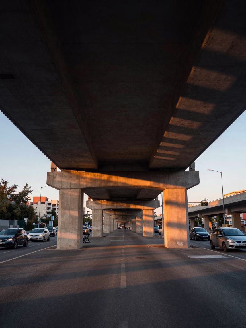 Barcelona Dawn Under Flyover Underside with Striped Shadows from Traffic in in Barcelona, Spain