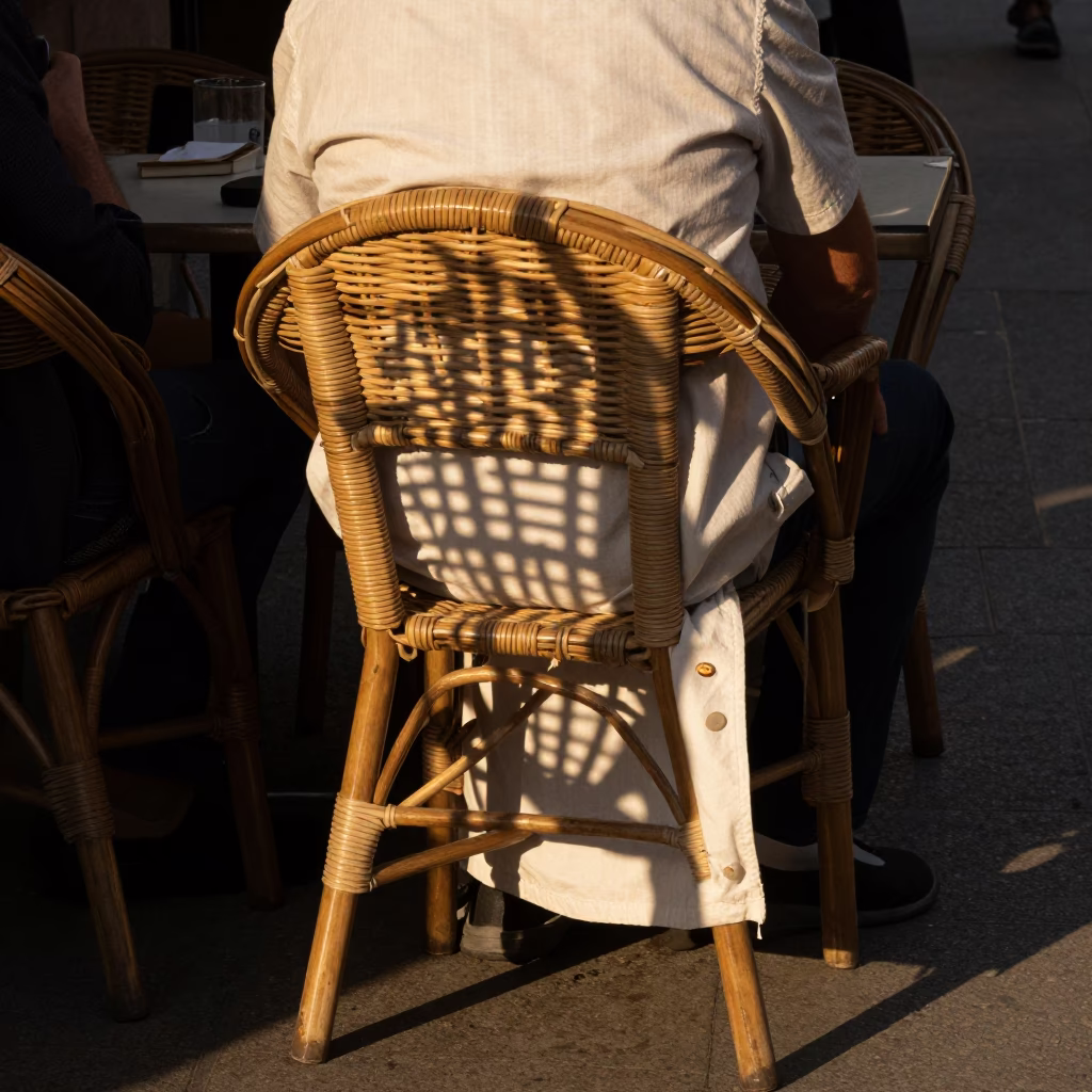 Barcelona Evening Street Scene with Wicker Shadow on Fabric and Puddle Reflections in in Barcelona, Spain