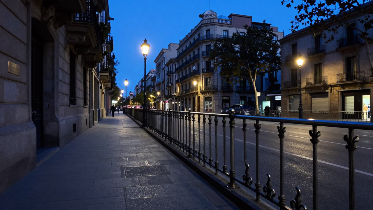 Barcelona Pre-Dawn Street Scene with Brushed Steel Rail and Classic Bus in in Barcelona, Spain