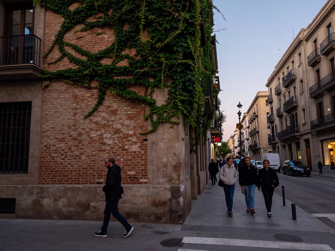 Barcelona Spain Early Evening Street Scene with Ivy Brick Wall and Bridge Maintenance Cradle in in Barcelona, Spain