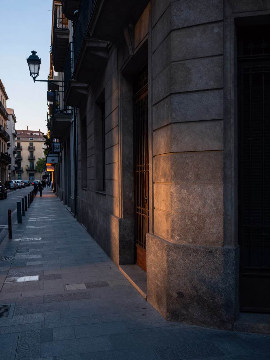 Barcelona Spain early morning street scene with rusted doorframe and flowerpot before sunrise in in Barcelona, Spain