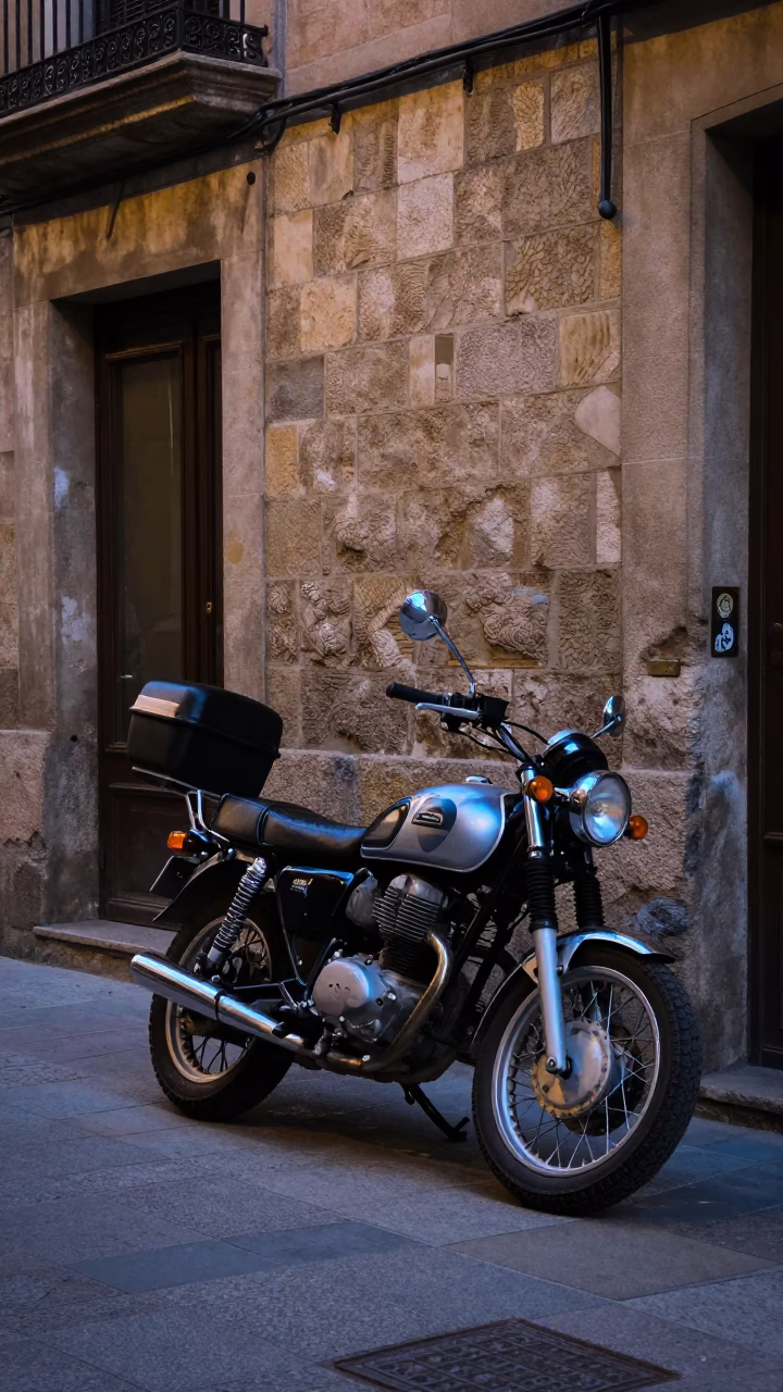 Barcelona Street Scene Before Dawn with Motorcycle and Alarm Clock in in Barcelona, Spain