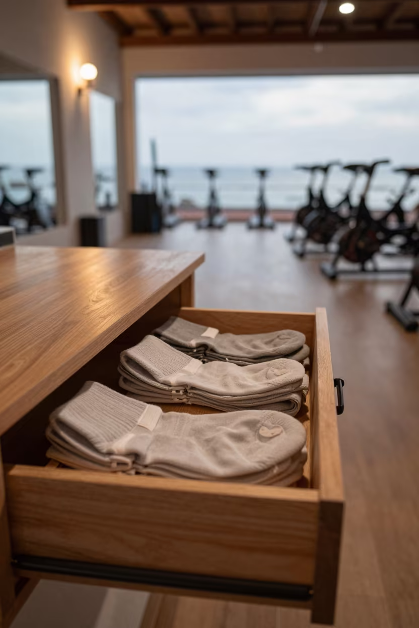 Barre Sock Drawer at Dawn in Carúpano Spin Studio in inside a spin studio under class lights near Carúpano
