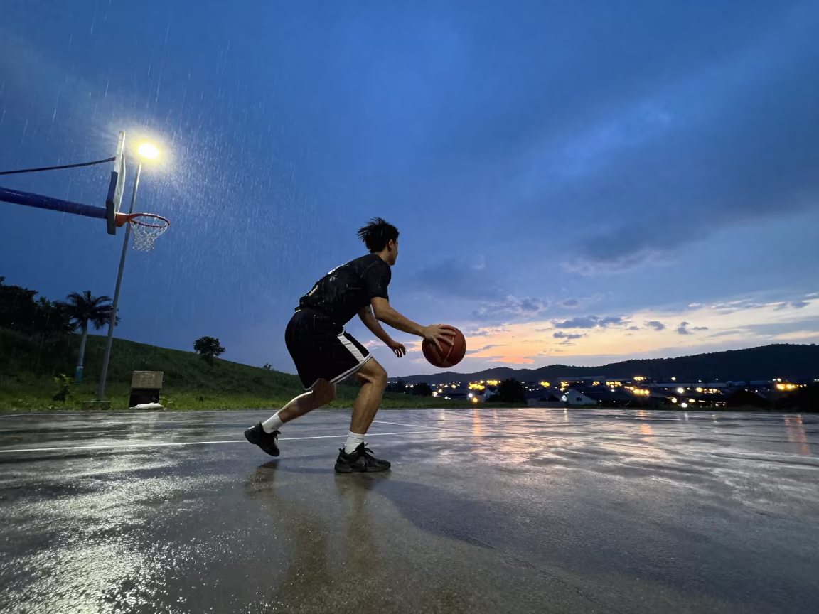 Basketball guard drives baseline in twilight in on a hillside near Cochabamba