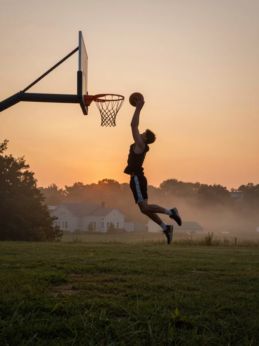 Basketball Player Dunking on Hillside at Sunset in on a hillside near Charlottetown