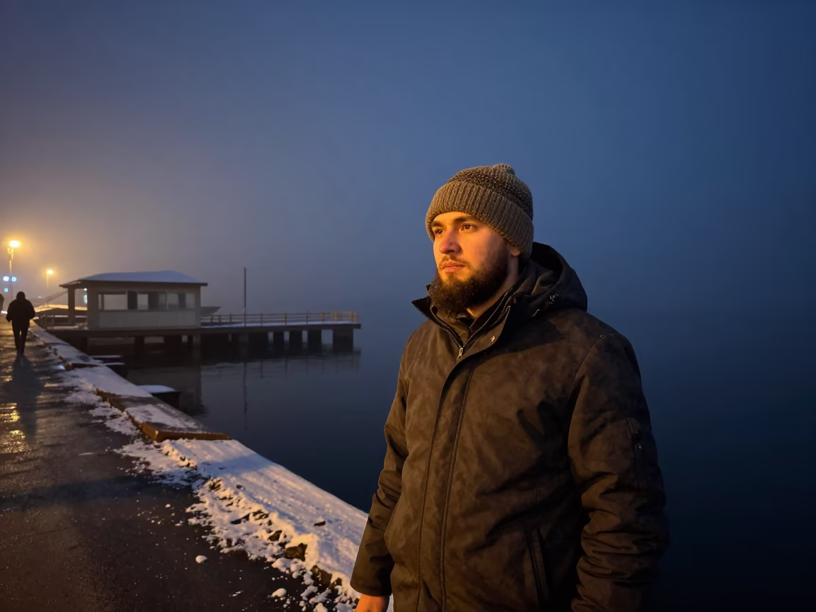 Bearded Man in Wool Cap at Oskemen Harbor Midnight in at a harbor edge in Oskemen