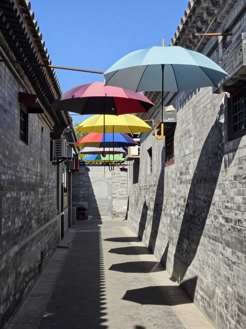 Beijing Alleyway Noon Shadows and Hanging Umbrellas in in Beijing, China