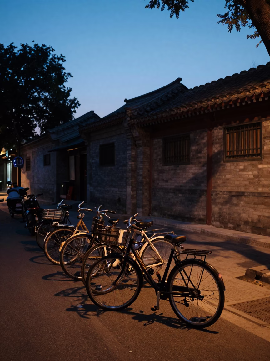 Beijing China twilight street scene with bicycles and traditional courtyard architecture in in Beijing, China