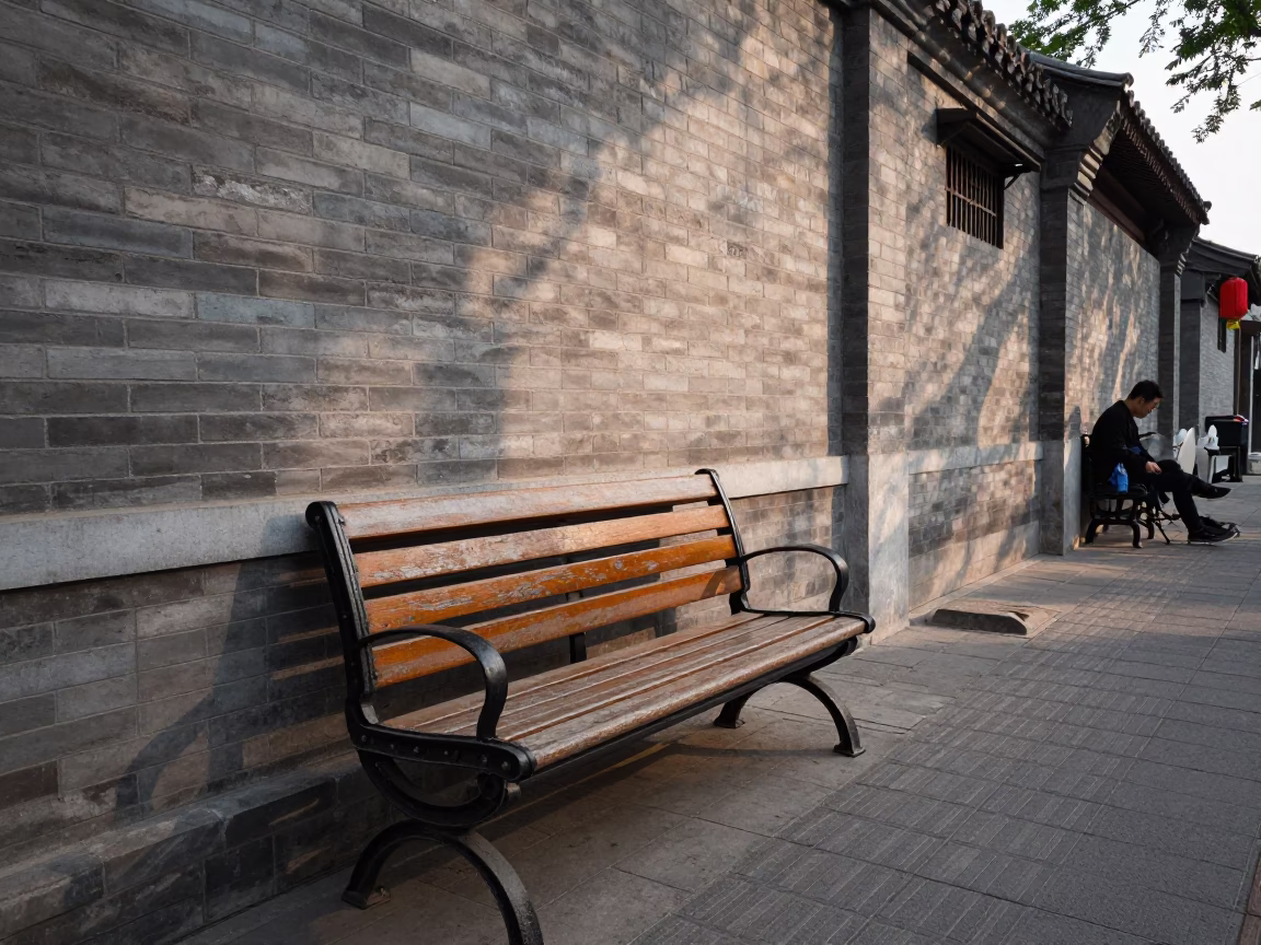 Beijing Hutong Alleyway Afternoon Life with Park Bench and Commuter Train Bridge in in Beijing, China