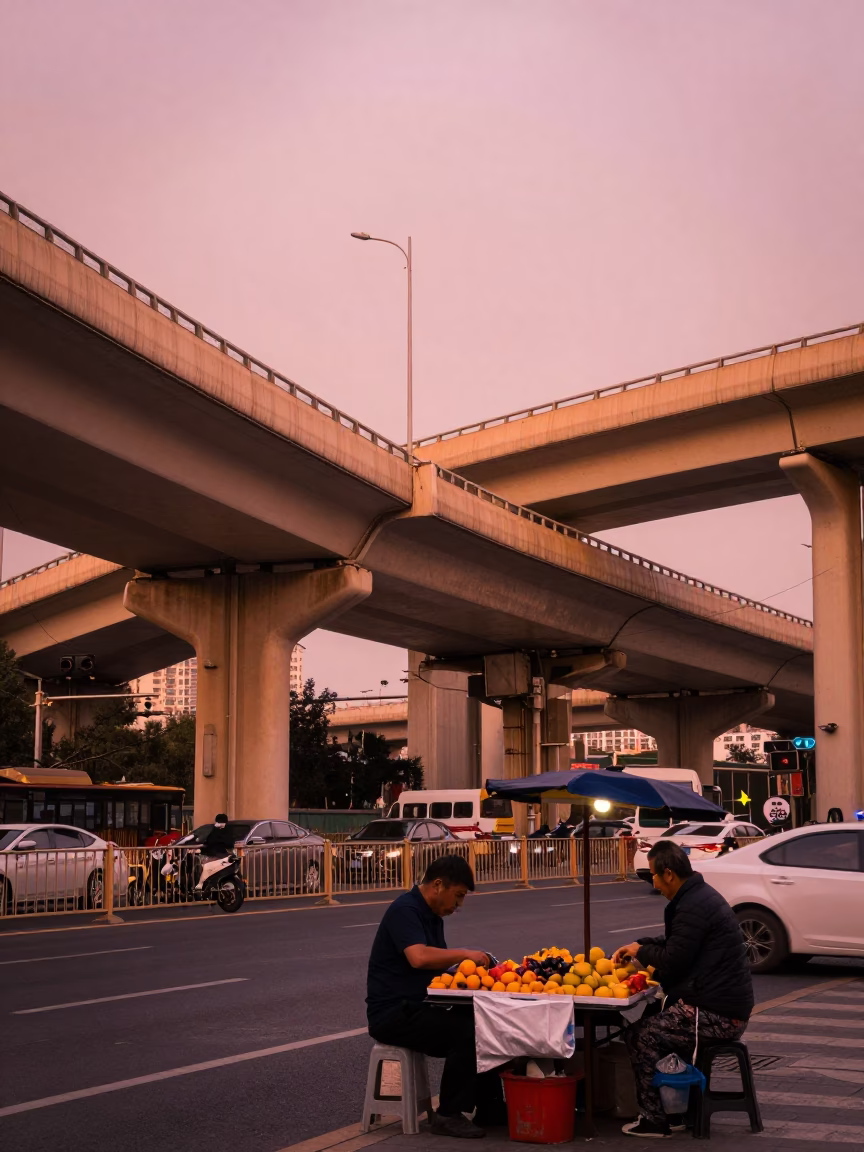 Beijing street scene with highway flyover and fruit vendor under copper dusk light in in Beijing, China