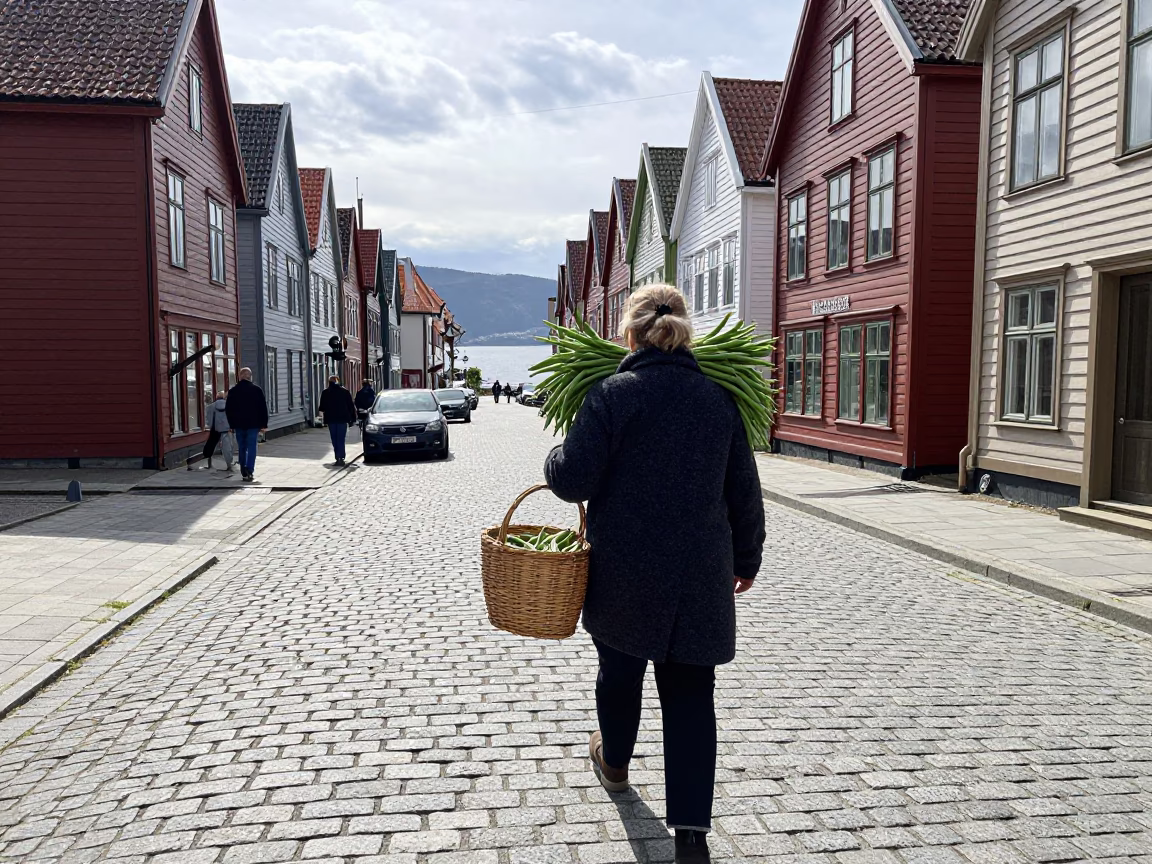 Bergen Norway noon street scene with woman carrying string beans near Bryghan wharf in in Bergen, Norway