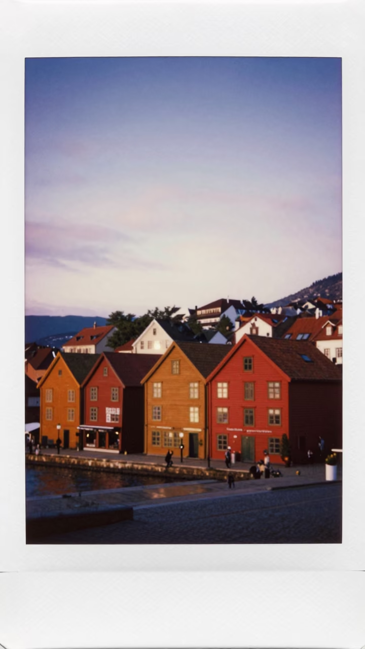 Bergen Norway Sunset View of Colorful Bryggen Wharf Buildings and Damp Cobblestone Street in in Bergen, Norway