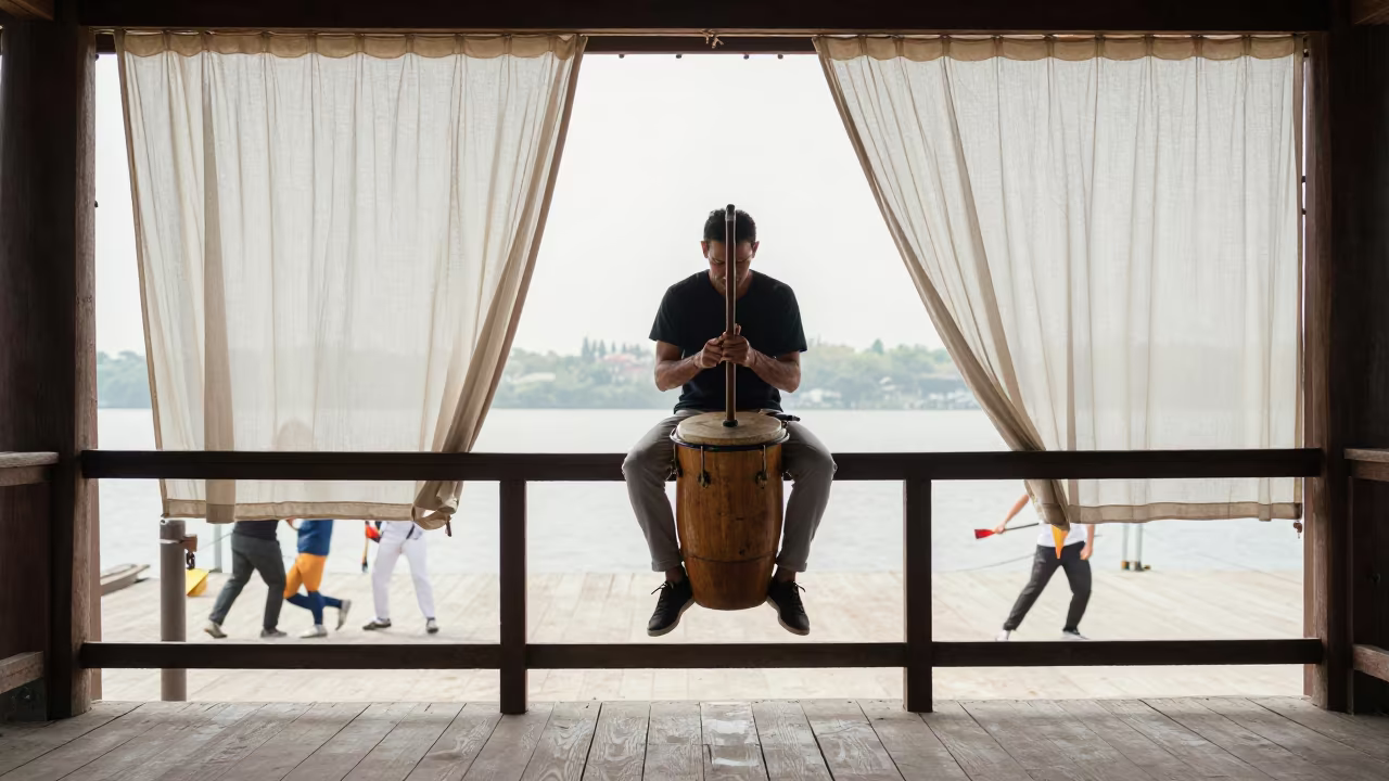 Berimbau Player on Wuhan Pier Droning Rhythm in on a pier railing in Wuhan