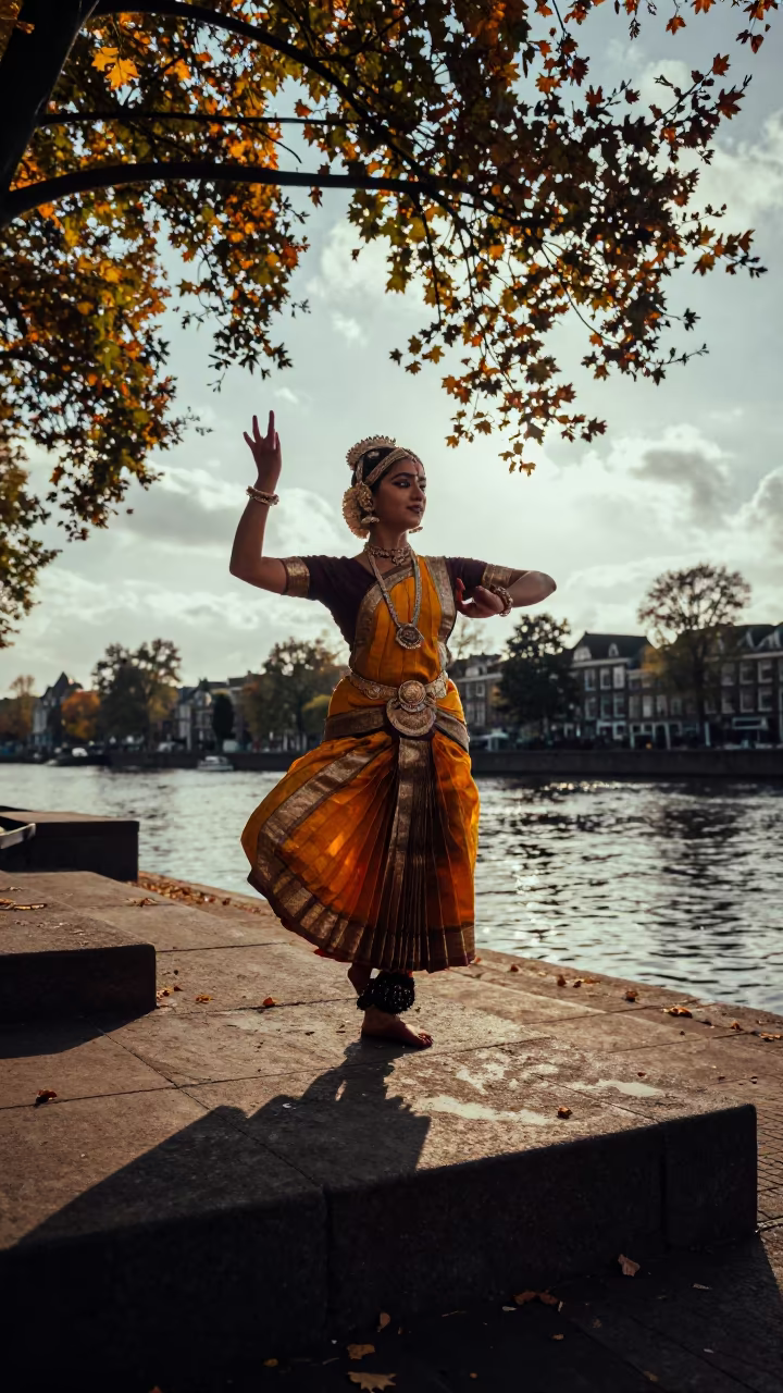 Bharatanatyam Dancer in Aramandi Pose on Autumn Steps in near a riverside landing in Leiden