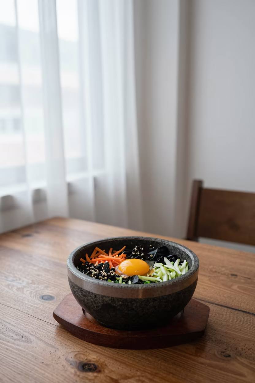 Bibimbap Bowl Raw Egg Georgetown Morning Light in on a rustic wooden table in Georgetown