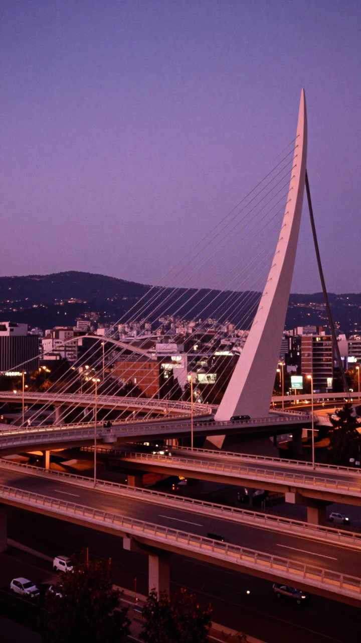 Bilbao Overpass Interchange Ramp Slicing Across Violet Evening Sky at Dusk in in Bilbao, Spain