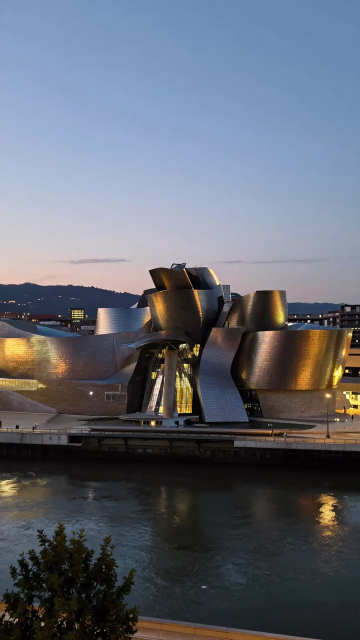 Bilbao Spain Evening Cityscape with Guggenheim Museum and Nervion River Reflections in in Bilbao, Spain