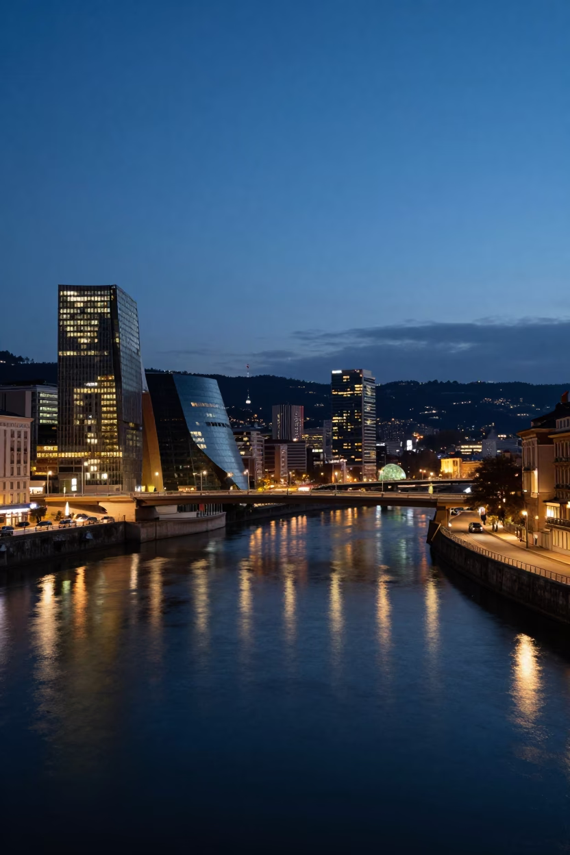 Bilbao Spain Evening Cityscape with River and Bridge Lights Reflecting on Water in in Bilbao, Spain