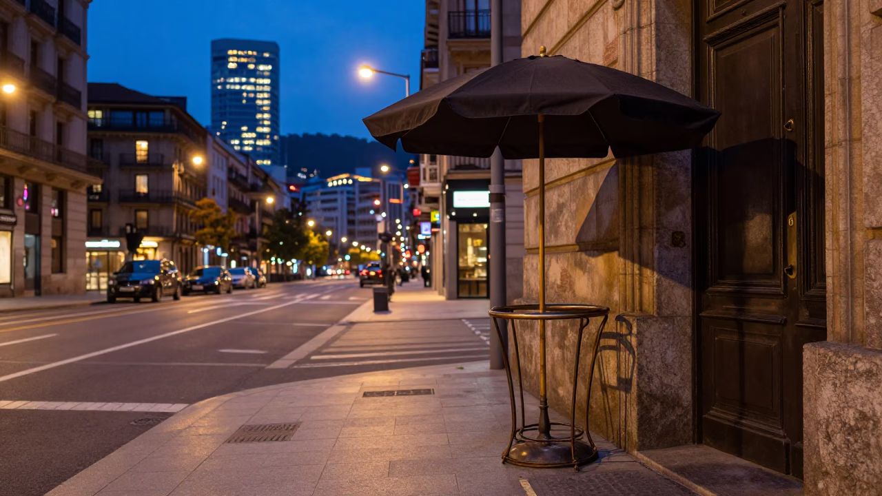 Bilbao Spain Evening Street Scene with Umbrella Stand and City Lights in in Bilbao, Spain