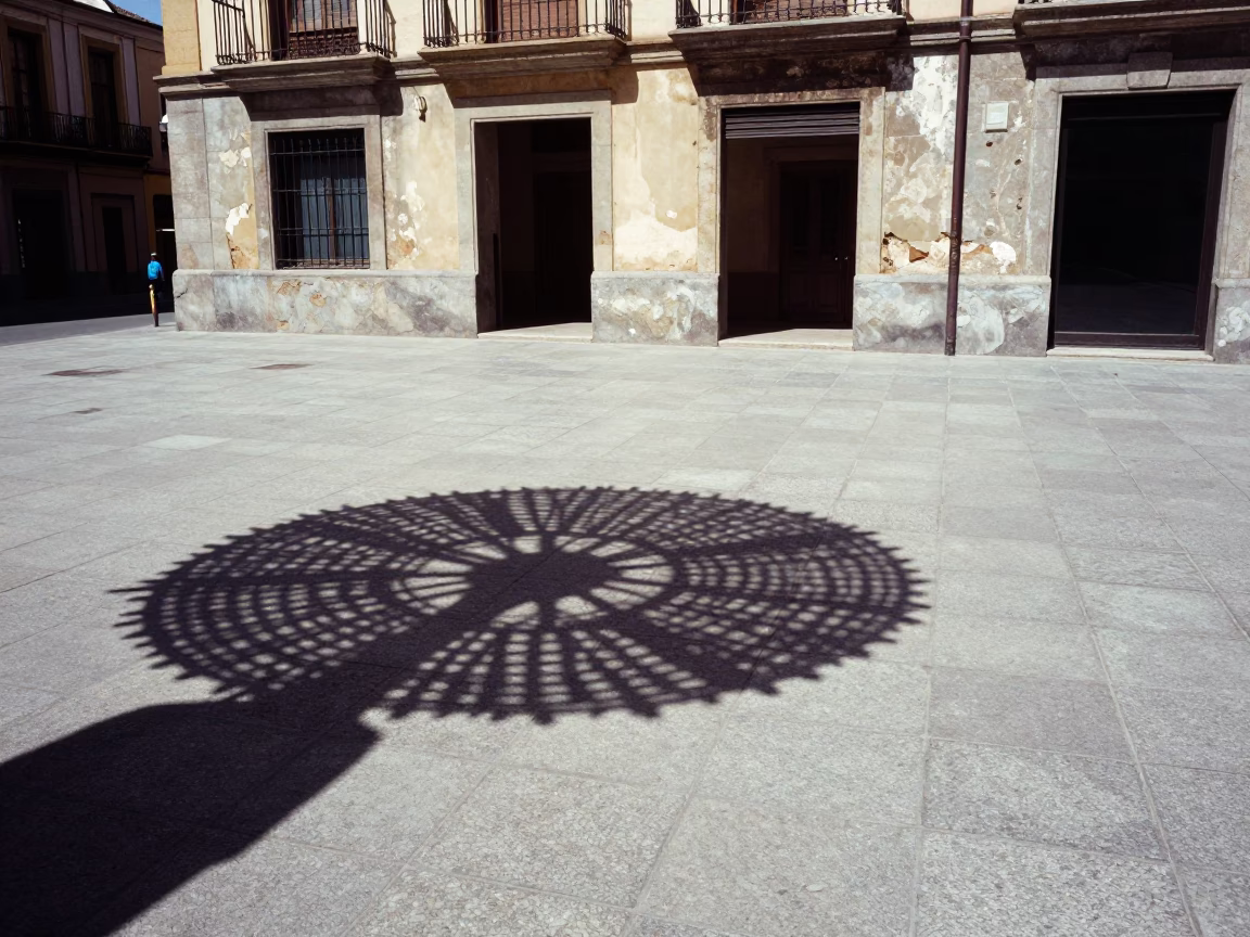 Bilbao Spain Noon Street Scene with Wicker Shadow on Tile and Traditional Cleaning Tools in in Bilbao, Spain