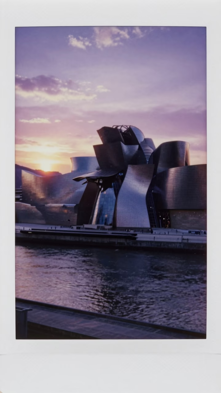 Bilbao Sunset Over Nervion River with Guggenheim Museum and City Skyline in in Bilbao, Spain